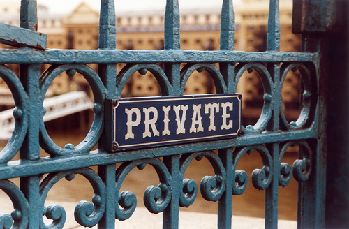 Iron gate with sign that says PRIVATE